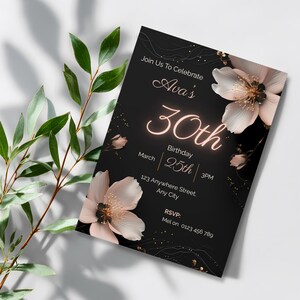 Elegant black birthday invitation with blush flowers and gold neon number, styled with green eucalyptus leaves on white background
