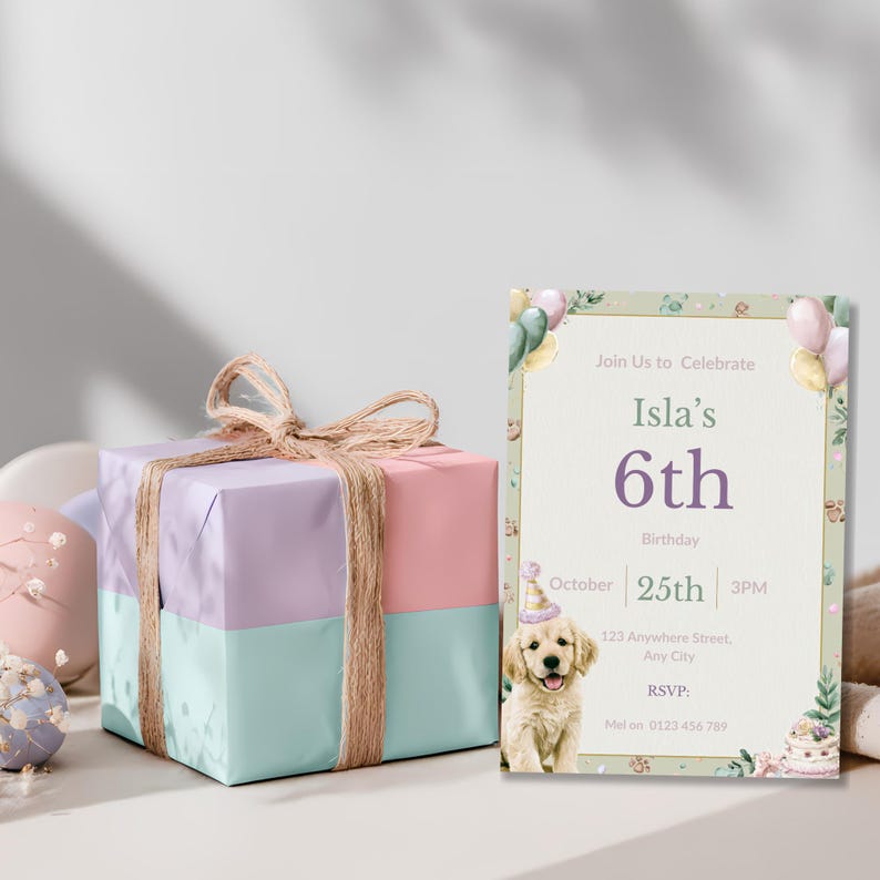 Watercolor puppy birthday invitation styled beside a wrapped pastel gift box for a girl's dog themed party