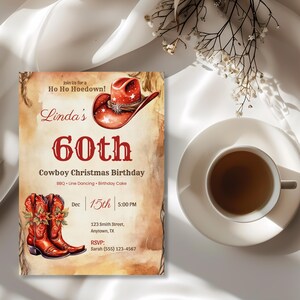 Western Christmas birthday invitation customized for Linda's 60th birthday hoedown with a red cowboy hat and poinsettia boots on white linen