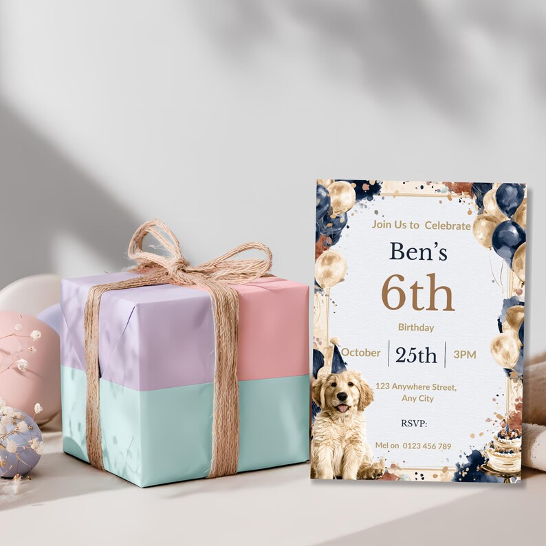 Watercolor puppy birthday invitation styled beside a wrapped pastel gift box for a boy's dog themed party