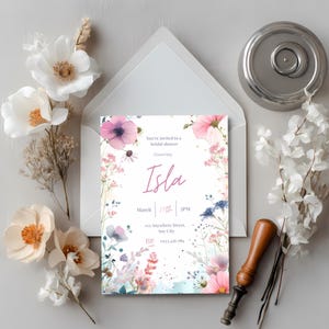 Elegant ivory floral bridal shower invitation styled with dried flowers and a vintage wax seal stamp for a timeless wedding shower look.