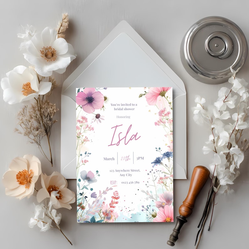 Elegant ivory floral bridal shower invitation styled with dried flowers and a vintage wax seal stamp for a timeless wedding shower look.