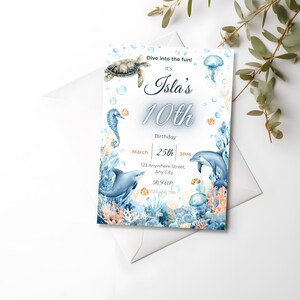 May include: A birthday invitation featuring an underwater theme. The invitation includes illustrations of a sea turtle, seahorse, dolphins, and jellyfish. The text reads "Isla's 10th Birthday" with the date March 25th and the time 3 PM.