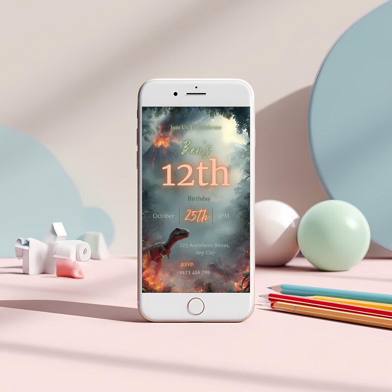 May include: A white smartphone displays a birthday invitation with a dinosaur theme. The invitation reads "Ben's 12th Birthday" with the date October 25th. The background features a volcano and a dinosaur.