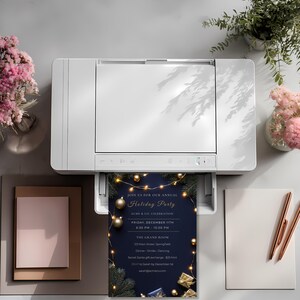 Printable navy and gold staff Christmas party invitation coming out of a printer, print at home, at the office or at a print shop