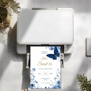 Printed Sweet 16 invitation with royal blue butterfly and watercolor floral border, shown on white background for party planning inspiration