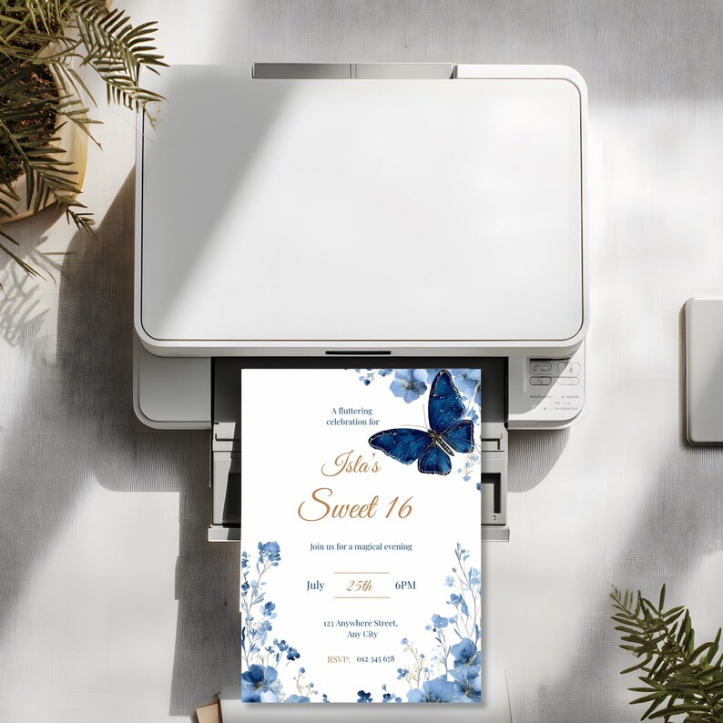 Printed Sweet 16 invitation with royal blue butterfly and watercolor floral border, shown on white background for party planning inspiration