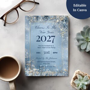 Editable Canva Cheers To The New Year invitation on a desk with glasses, coffee and succulents, navy text on a silver and blue sparkle background