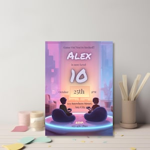 Gaming birthday invitation template leaning against a wall with confetti and ribbon, video game themed party invite styled photo