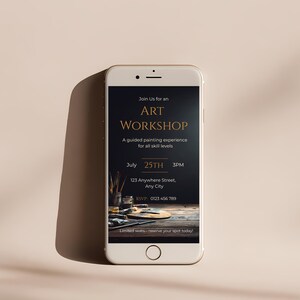 Professional art workshop invitation template featuring dramatic studio lighting paint tubes and brushes editable Canva design