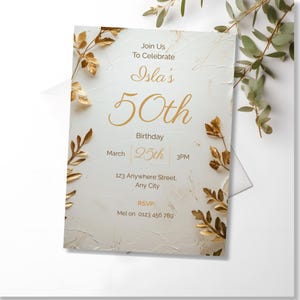Close up of cream plaster texture and gold botanical leaf frame on luxury 70th birthday invitation — editable Canva template for women