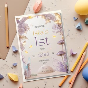 Editable fairy first birthday invitation template flat lay with colorful pencils and paper confetti shapes showing purple mushroom fairy floral arch Canva design instant download