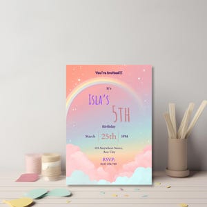 editable birthday invitation template on a craft desk with envelope and stickers