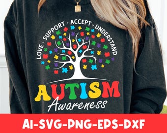 May include: A black sweatshirt with a white tree design made up of colorful puzzle pieces. The text "LOVE - SUPPORT - ACCEPT - UNDERSTAND" surrounds the tree. Below the tree is the text "AUTISM Awareness".