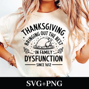 May include: White t-shirt with black text that reads "Thanksgiving Bringing Out The Best In Family Dysfunction Since 1612". The text is surrounded by stars and a drawing of a Thanksgiving turkey.