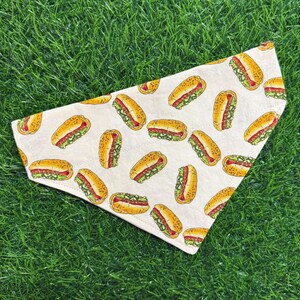 This over the collar dog bandana features Chicago-style hotdogs on cream cotton background