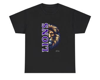May include: Black t-shirt with a purple "LIONS" graphic and a lion's face on the right side. The text "JSCA" is printed below the lion's face.