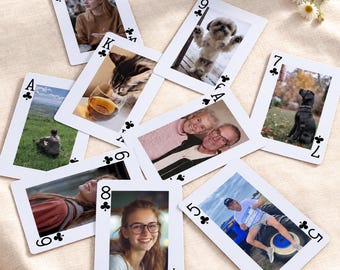 May include: A collection of eight custom playing cards featuring various photographic images, including portraits of people, a cat, a dog, and outdoor scenes. Each card displays a club suit symbol and a number or letter in the corners.