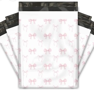 May include: A pack of five white poly mailers with a black border and a repeating pattern of pink bows.