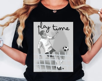 May include: Black t-shirt with a graphic of a soccer player kicking a ball into a net. The graphic is in black and white and the text "play time" is above the graphic.