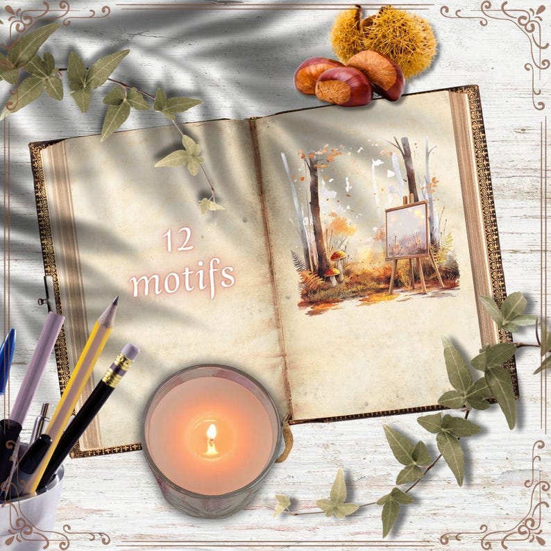 May include: An open book with a watercolor painting of a forest scene, a lit candle, pencils, and the text "12 motifs." The book is surrounded by leaves and chestnuts, creating a cozy, autumnal theme. The candle is in a clear glass container.