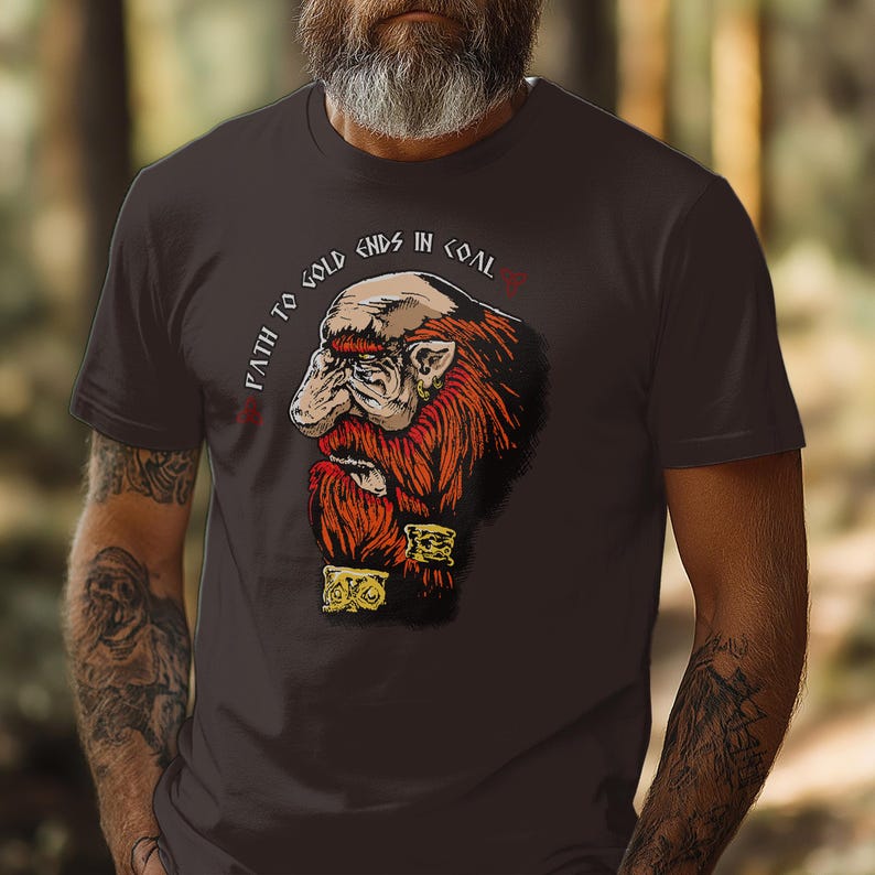 May include: A dark gray t-shirt with a cartoon illustration of a dwarf with a red beard and the text "Path to gold ends in coal".