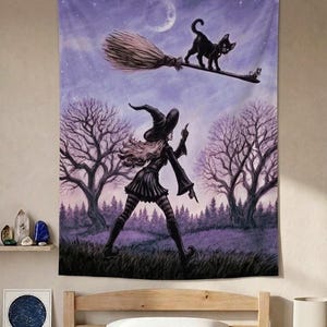May include: A rectangular wall tapestry featuring a purple-toned illustration of a witch in a pointed hat and striped stockings walking through a forest. Above, a black cat stands on a flying broomstick against a night sky with a full moon.