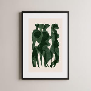 May include: Abstract art print featuring a dark green watercolor design of overlapping figures. The artwork is framed in a black frame and set against a cream-colored background. The figures have a flowing, organic shape.