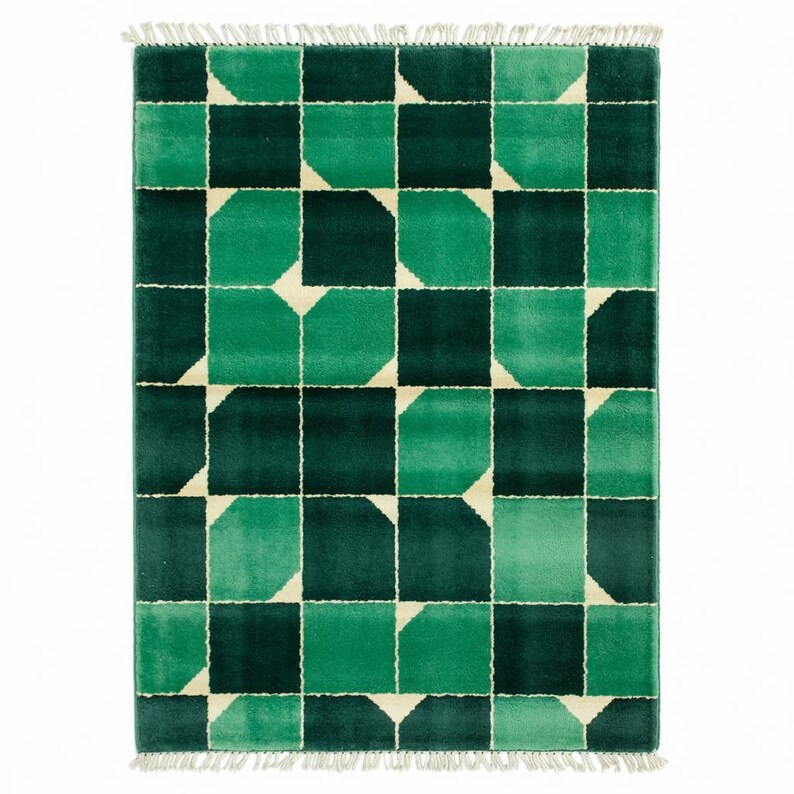 Handmade green geometric wool rug featuring bold modern Art Deco design elements, handwoven by skilled artisans using high-quality natural fibers. This luxurious area rug is perfect for adding a vibrant, graphic statement to living rooms, bedrooms, and stylish interiors. With its sharp clean lines and emerald green tones, it blends contemporary sophistication with cozy handmade warmth, ideal for designer, modern, or eclectic home decor.