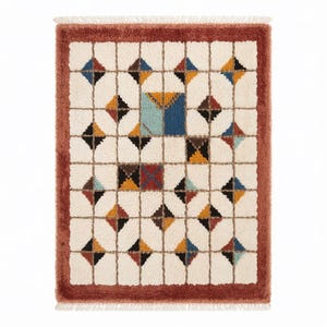 Soft, plush Moroccan Mrirt rug in a creamy wool tone, featuring a unique grid of raised square tiles. The design creates a highly tactile and dimensional surface perfect for contemporary or minimalist interiors. Hand-knotted with precision by Berber artisans, this luxurious rug adds depth, comfort, and understated style to living rooms, bedrooms, or cozy reading corners. A high-end handmade carpet for those who value both texture and design.