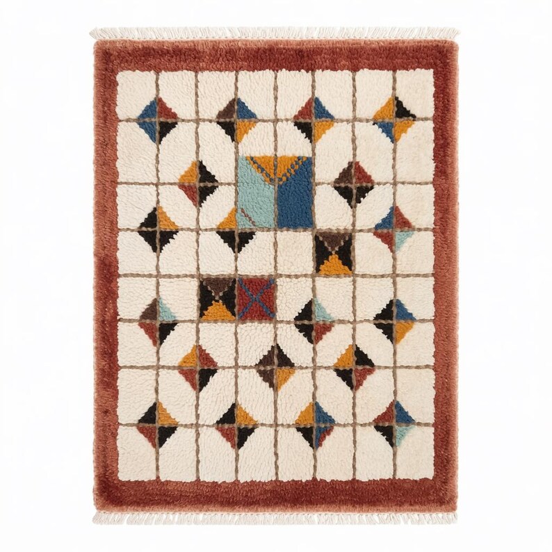 Soft, plush Moroccan Mrirt rug in a creamy wool tone, featuring a unique grid of raised square tiles. The design creates a highly tactile and dimensional surface perfect for contemporary or minimalist interiors. Hand-knotted with precision by Berber artisans, this luxurious rug adds depth, comfort, and understated style to living rooms, bedrooms, or cozy reading corners. A high-end handmade carpet for those who value both texture and design.