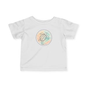 May include: White t-shirt featuring a circular design with a sea turtle outline. The turtle is set against a watercolor background of orange, teal, and pink. The text "Jupiter, FL" is below the design.