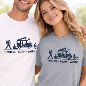 Smiling man and woman outdoors wearing “EVOLVE · ROAM · WORK” graphic t-shirts — man in white, woman in light grey — with a camper van and remote-work silhouettes printed on the front.