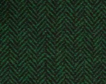 May include: Green and black herringbone fabric with a subtle texture.