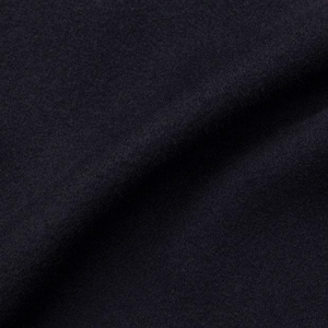 May include: Close-up of a dark blue fabric with a smooth, even texture. The fabric has a slight sheen and is soft to the touch.