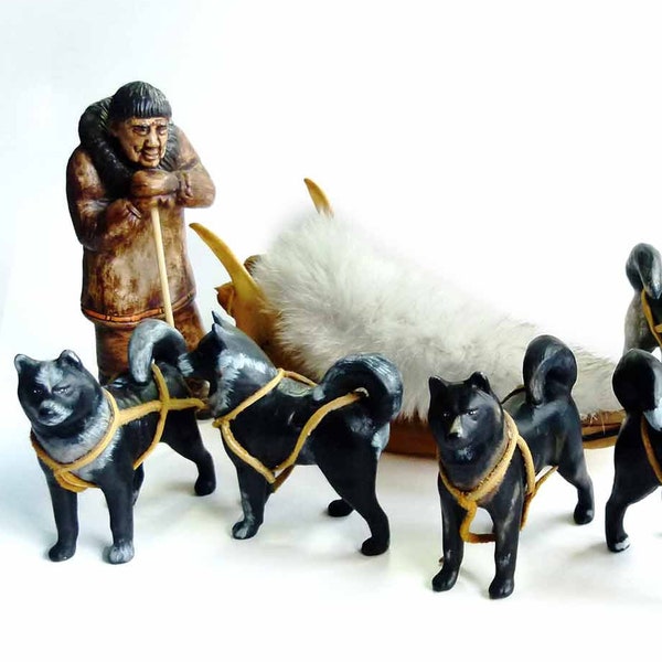 Antique Alaskan Toy Caribou Jawbone Sled with Ceramic Eskimo with 7 Unique Sled Dogs Moose Hide Pouch Rabbit Fur Throw