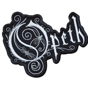 May include: Black and white embroidered patch with the word "Opeth" in a stylized font. The "O" is a stylized design with intricate swirls.