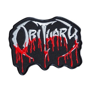 Peut inclure: Patch brodé noir et blanc avec le mot "Obituary" en blanc avec du sang rouge qui coule.
