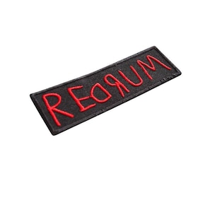 May include: Black fabric patch with red embroidered text that reads "Requiem".