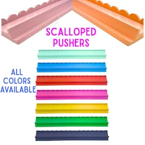 May include: A variety of colorful, scalloped pushers in shades of pink, orange, mint, blue, red, fuchsia, yellow, green, and navy. Text reads "Scalloped Pushers" and "All Colors Available."