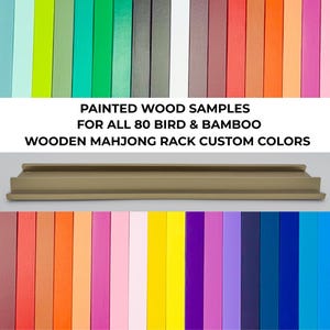 May include: A display of painted wood samples in various colors, including green, red, pink, and blue. The samples are for custom colors for a wooden Mahjong rack. The text on the image reads "Painted Wood Samples for All 80 Bird & Bamboo Wooden Mahjong Rack Custom Colors."