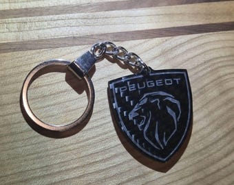 Porte clé Peugeot en Carbone