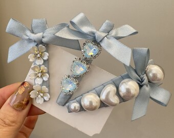 New light blue bow hair clip small fresh pearl rhinobar breaking clip niche design duck beak clip