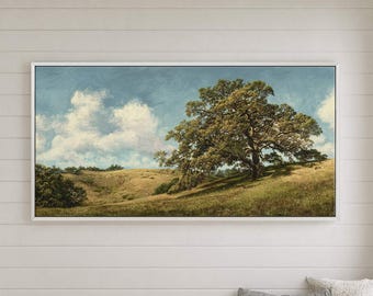 May include: A framed landscape painting of a large tree on a grassy hill under a cloudy sky. The artwork hangs above a wooden bench in a white-walled hallway. Two pillows rest on the bench.