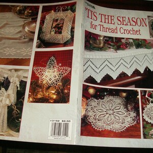 May include: A magazine spread showcasing various thread crochet designs. Featured items include a star, angels, a table runner, a picture frame, and Christmas ornaments. The cover reads "'Tis the Season for Thread Crochet."