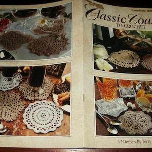 May include: A craft instruction booklet titled Classic Coasters to Crochet featuring 12 designs by Terry Kimbrough. The cover displays various crocheted coasters in white and tan thread, arranged under glassware, plates, and spoons in multiple photographs.