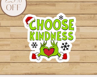 May include: A sticker with the words "CHOOSE KINDNESS" in green, with a red heart and Grinch-like hands forming the heart. The sticker has a Santa hat on the letter "O" and snowflakes. A circular label reads "25% OFF".