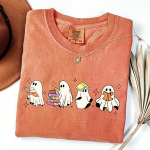Comfort Colors® Ghost Reading Books Shirt, Bookish Halloween Shirt, Teacher Librarian Halloween Gift, Halloween Book Lover, Halloween School Cute Ghost Reading Book Halloween Tshirt, Ghost Reading Book Girly Shirt, Ghost Girly Halloween Gift, Trendy Halloween Gift