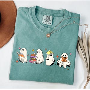 Comfort Colors® Ghost Reading Books Shirt, Bookish Halloween Shirt, Teacher Librarian Halloween Gift, Halloween Book Lover, Halloween School Cute Ghost Reading Book Halloween Tshirt, Ghost Reading Book Girly Shirt, Ghost Girly Halloween Gift, Trendy Halloween Gift