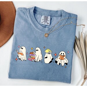 Comfort Colors® Ghost Reading Books Shirt, Bookish Halloween Shirt, Teacher Librarian Halloween Gift, Halloween Book Lover, Halloween School Cute Ghost Reading Book Halloween Tshirt, Ghost Reading Book Girly Shirt, Ghost Girly Halloween Gift, Trendy Halloween Gift